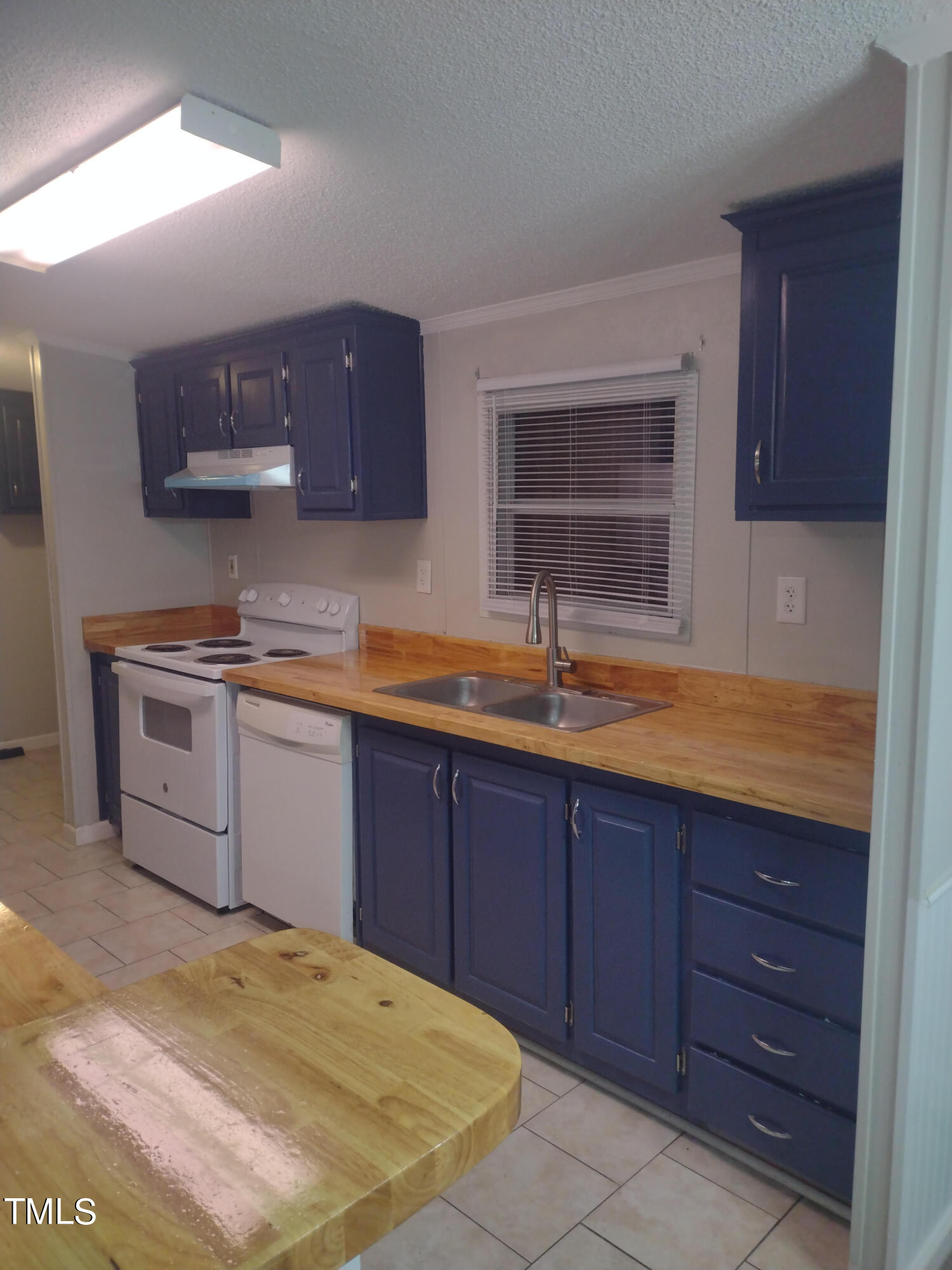 437 West Northpoint Road Spring Lake, NC 28390 - Photo 10 of 27 a kitchen with a sink a stove and cabinets
