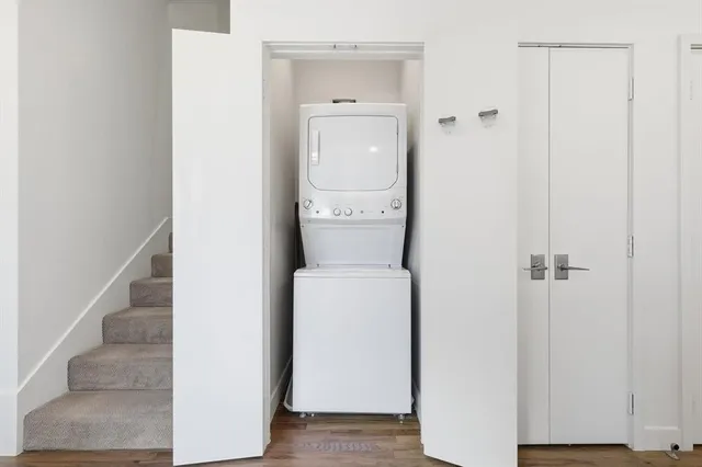 a bathroom with a granite countertop sink mirror vanity and toilet