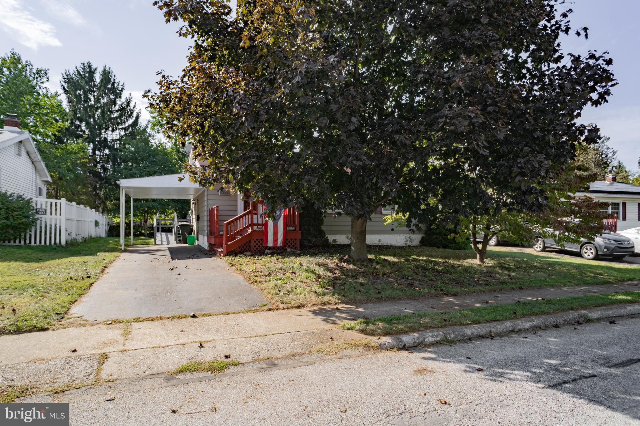 824 Gunnison Road York, PA 17404 - Photo 1 of 16 a view of a house with a yard and large tree