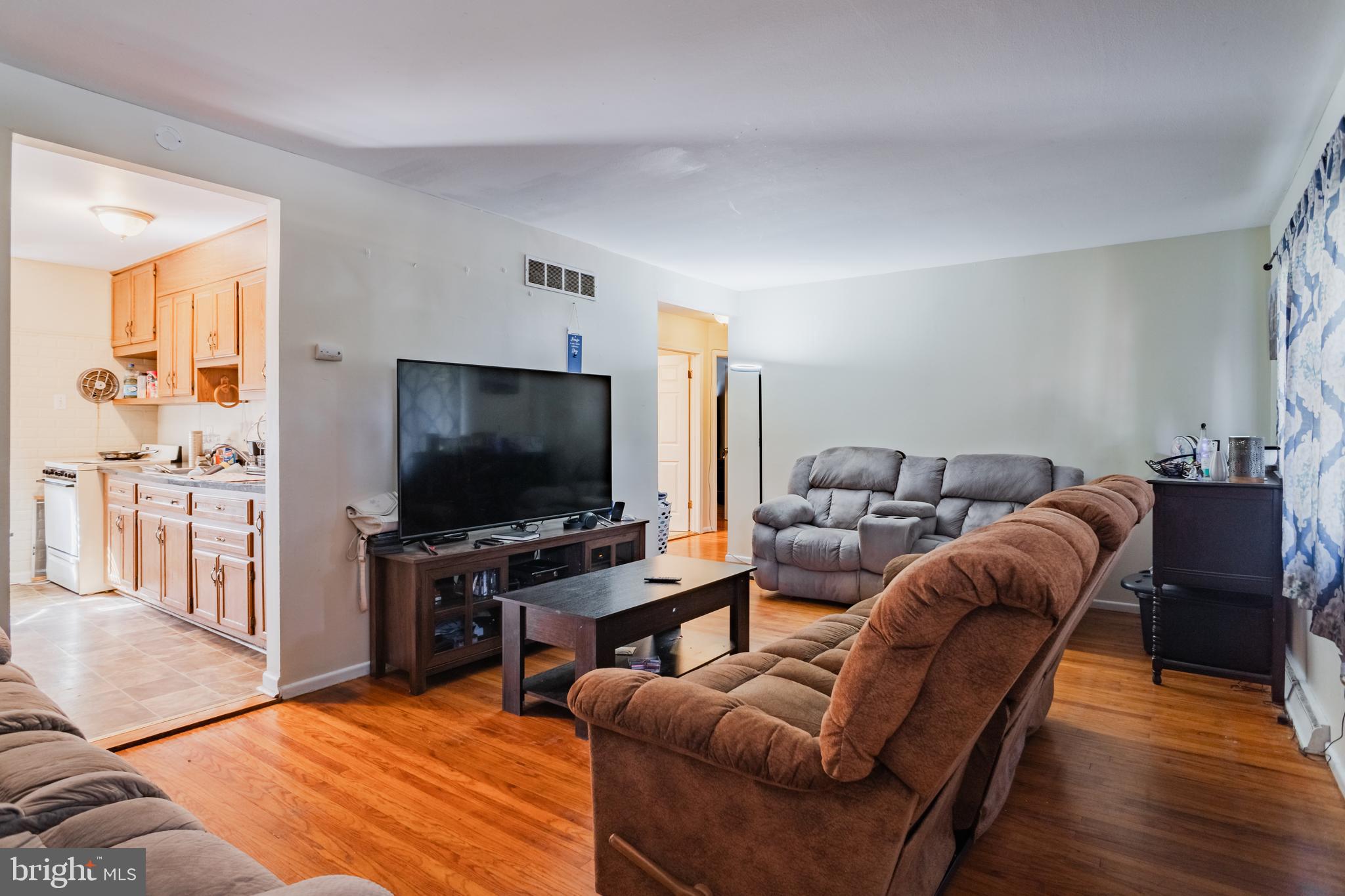 824 Gunnison Road York, PA 17404 - Photo 8 of 16 a living room with furniture and a flat screen tv