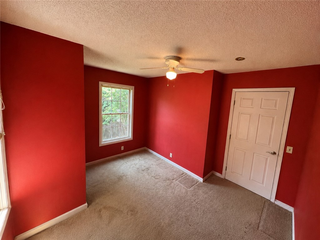 138 Cloverdale Road Seneca, SC 29678 - Photo 13 of 27 A well-lit room awaits your personal touch with ample space and a view to the outdoors.