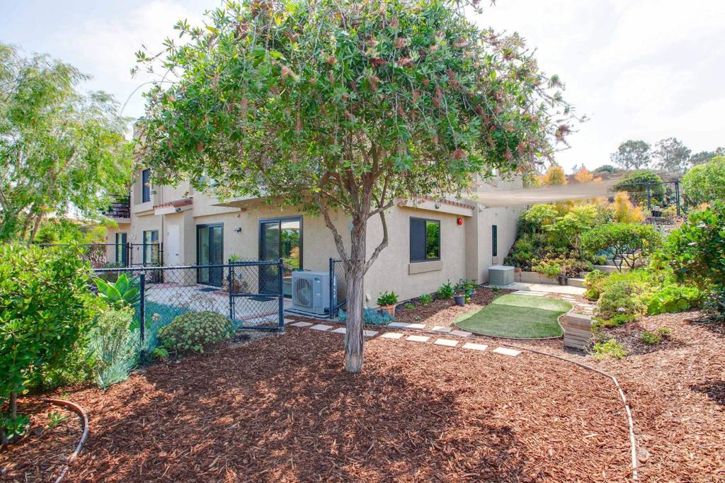 597 Via Cantebria Encinitas, CA 92024 - Photo 33 of 41 a view of a house with backyard and a tree
