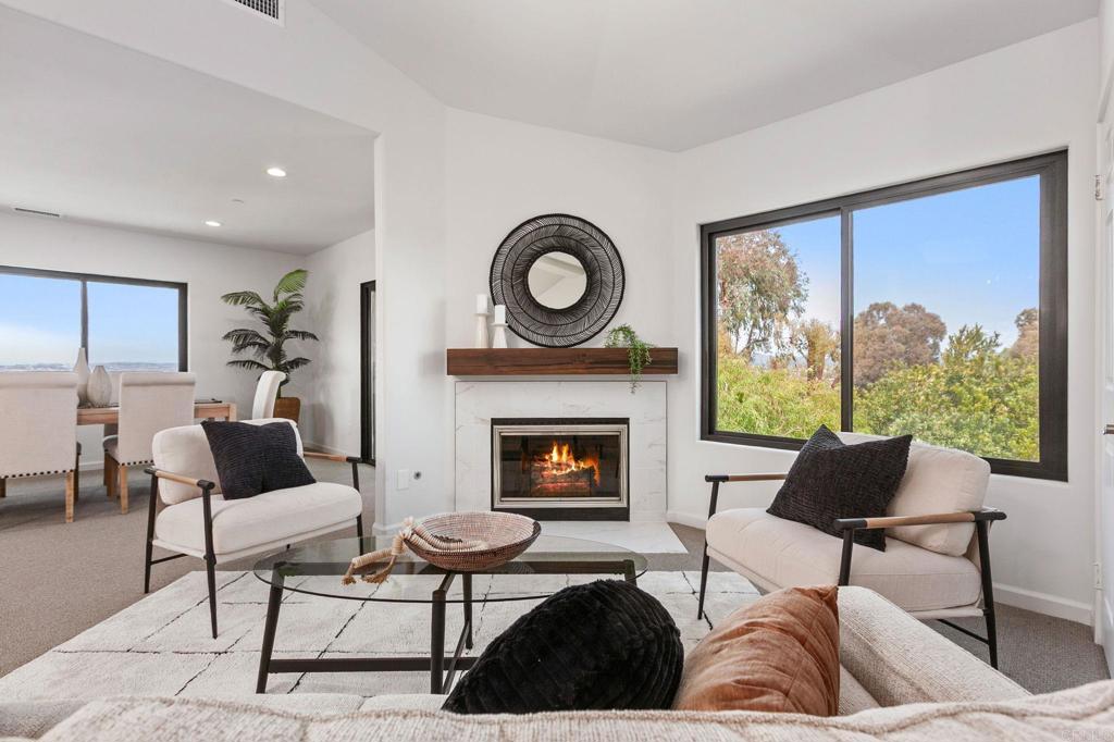 597 Via Cantebria Encinitas, CA 92024 - Photo 5 of 41 a living room with furniture and a fireplace