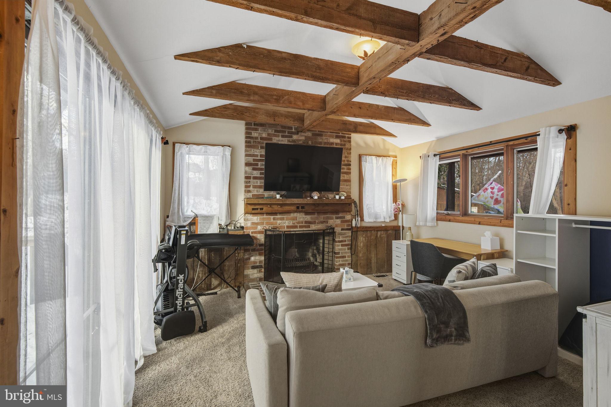 137 Plum Point Road Elkton, MD 21921 - Photo 12 of 54 a living room with furniture and a flat screen tv