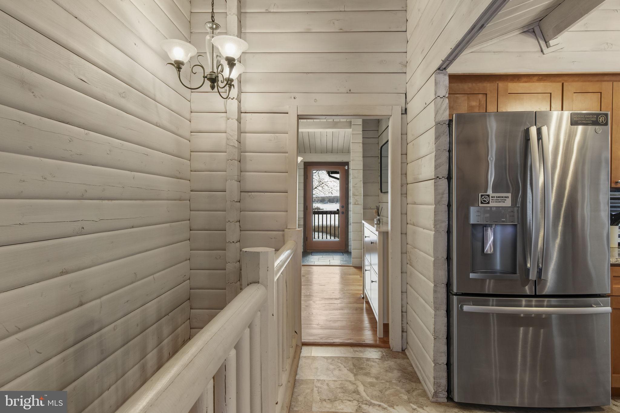 137 Plum Point Road Elkton, MD 21921 - Photo 14 of 54 a view of a refrigerator in kitchen and an empty room