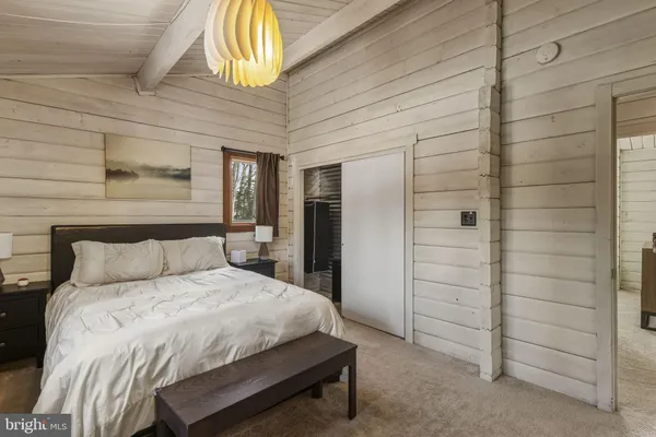 a bedroom with a bed and a table