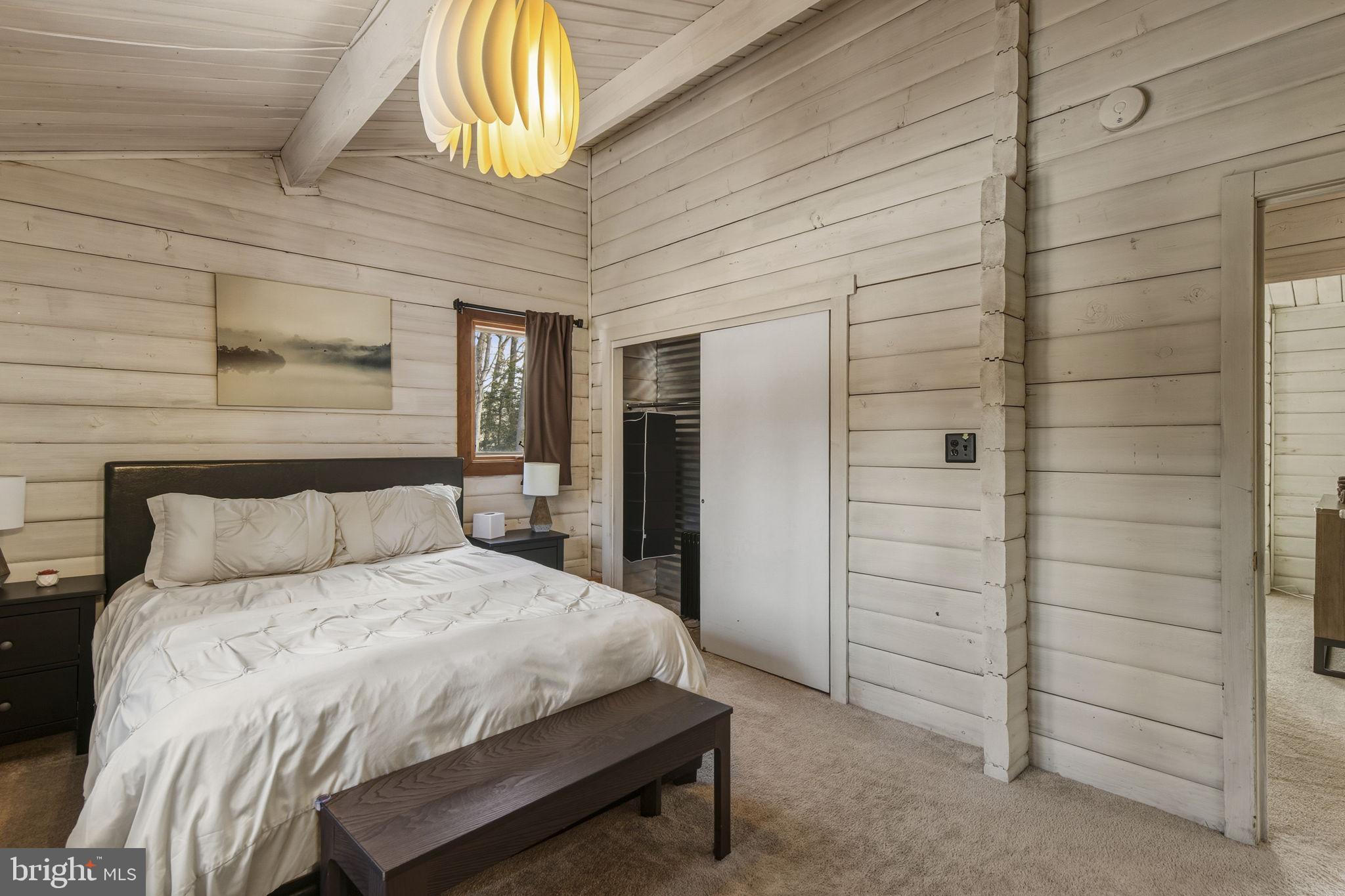 137 Plum Point Road Elkton, MD 21921 - Photo 17 of 54 a bedroom with a bed and a table