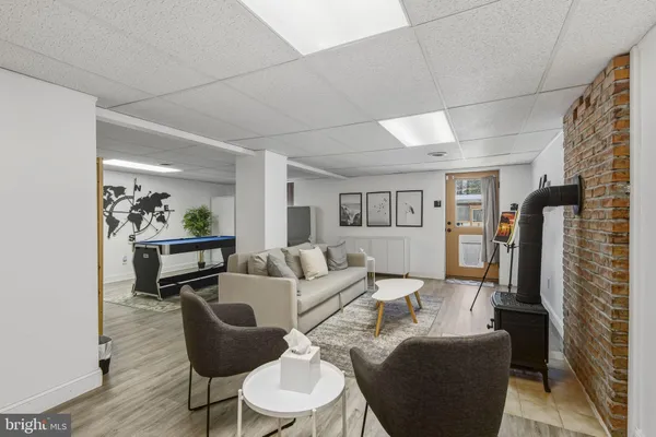 a living room with furniture and a rug