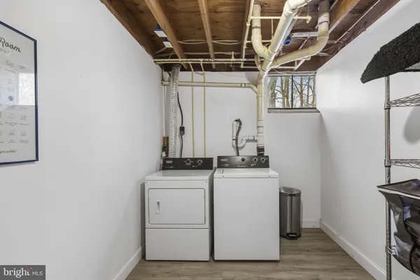 a backyard of a house with barbeque oven wooden floor and a view of outdoor space