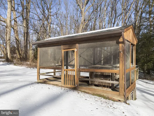 a view of a house with a large tree