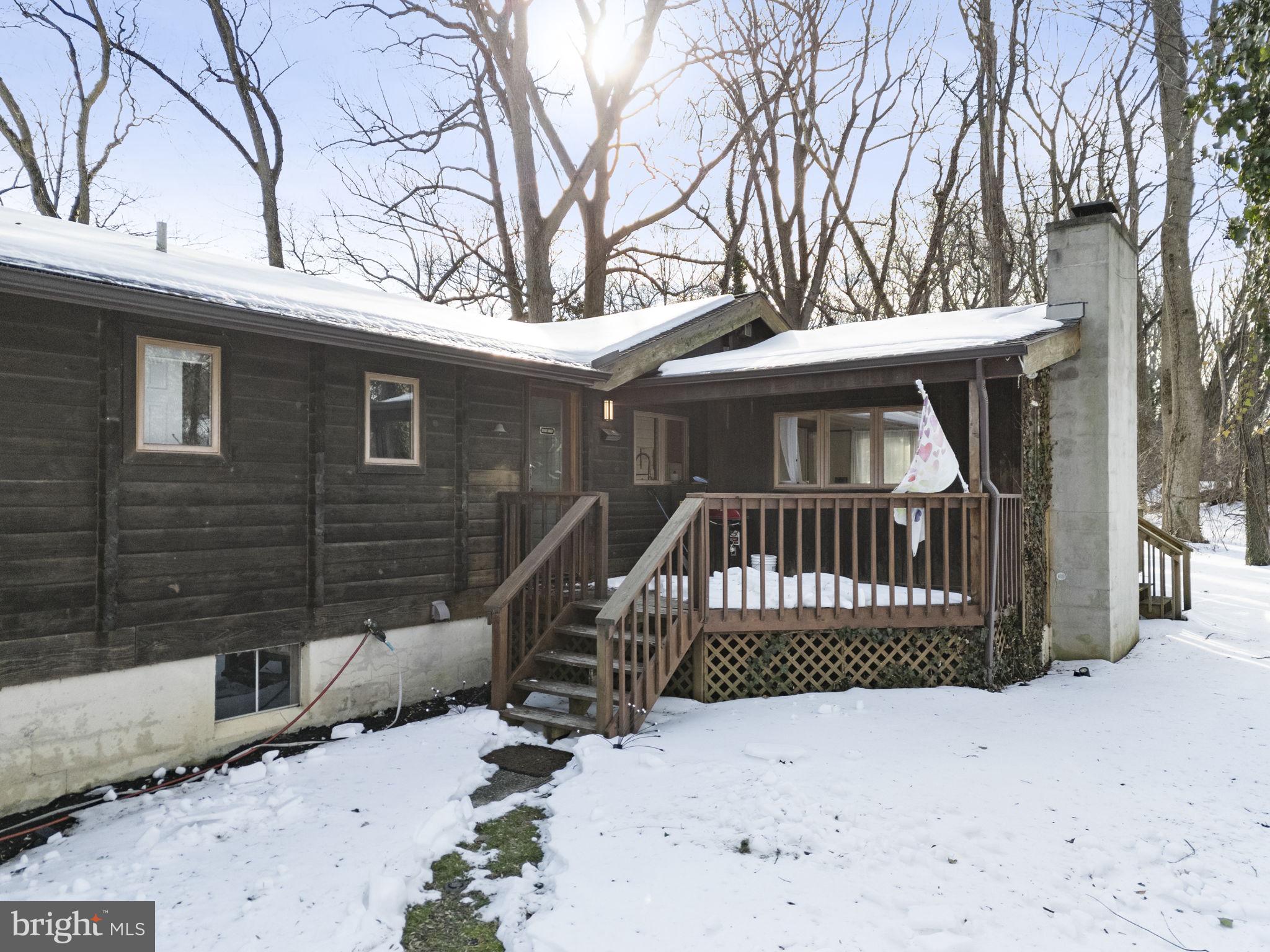 137 Plum Point Road Elkton, MD 21921 - Photo 47 of 54 a view of a wooden deck with large trees and wooden fence