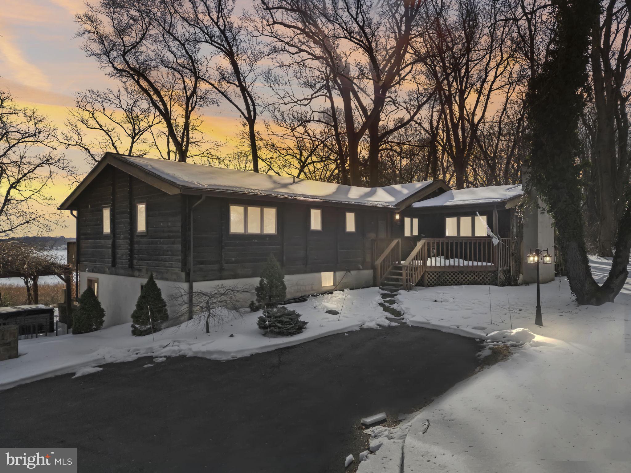 137 Plum Point Road Elkton, MD 21921 - Photo 48 of 54 a front view of a house with fire pit and couches