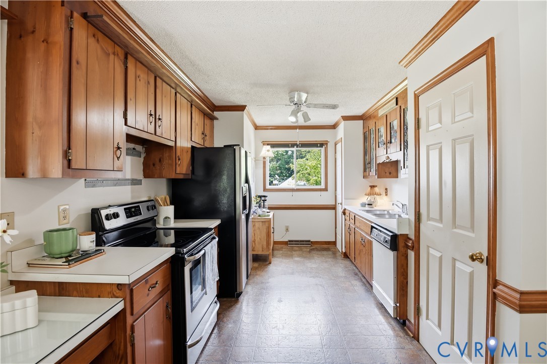 3231 Ludgate Road Chester, VA 23831 - Photo 13 of 34 Kitchen featuring wood cabinetry, white countertop