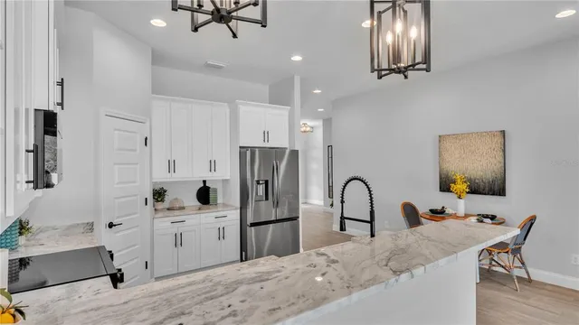 a bedroom with bed and a potted plant