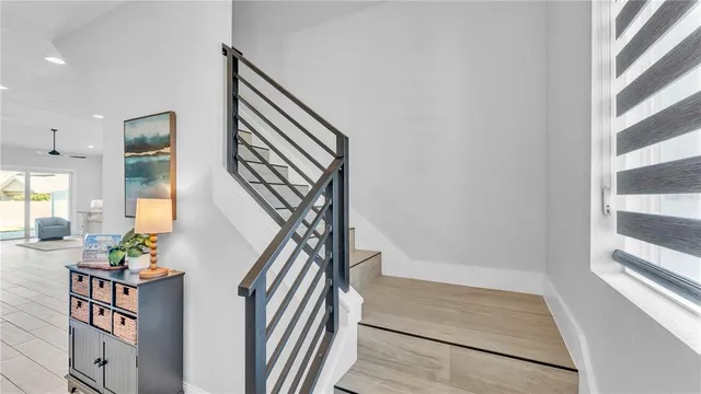 a view of entryway and hall with wooden floor