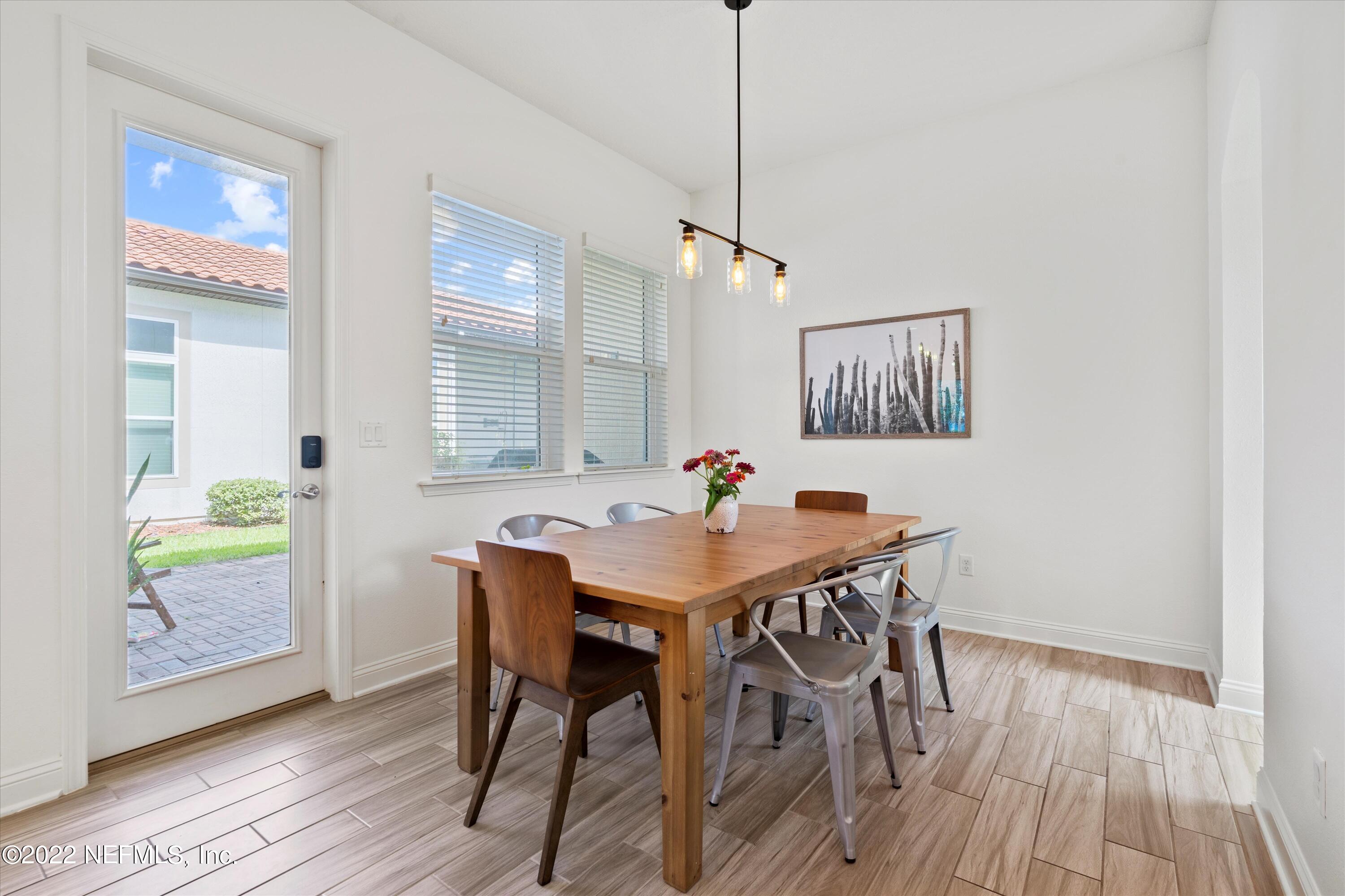 245 Rialto Drive Ponte Vedra, FL 32081 - Photo 11 of 29 a view of a dining room with furniture and wooden floor
