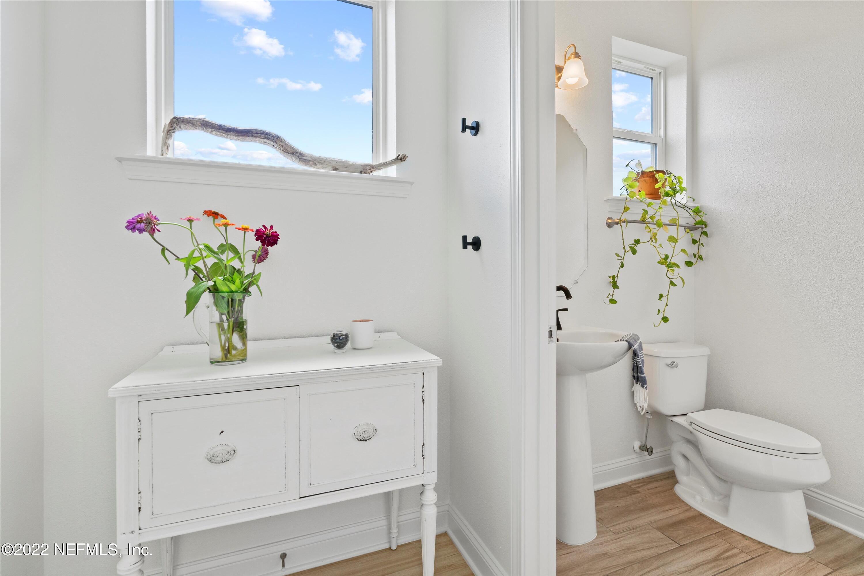 245 Rialto Drive Ponte Vedra, FL 32081 - Photo 12 of 29 a bathroom with a sink a mirror and a toilet