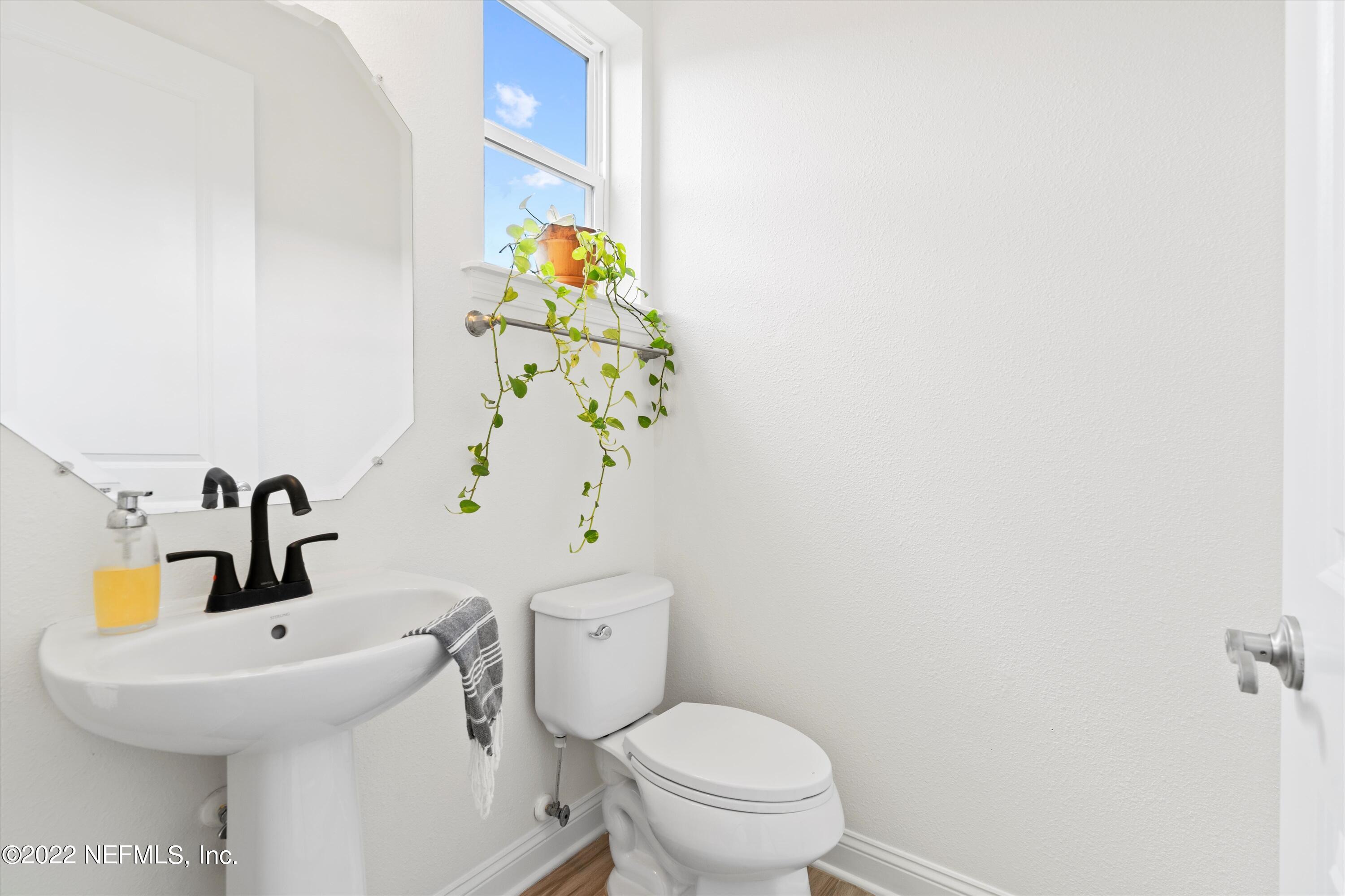 245 Rialto Drive Ponte Vedra, FL 32081 - Photo 13 of 29 a white toilet sitting next to a bathroom sink