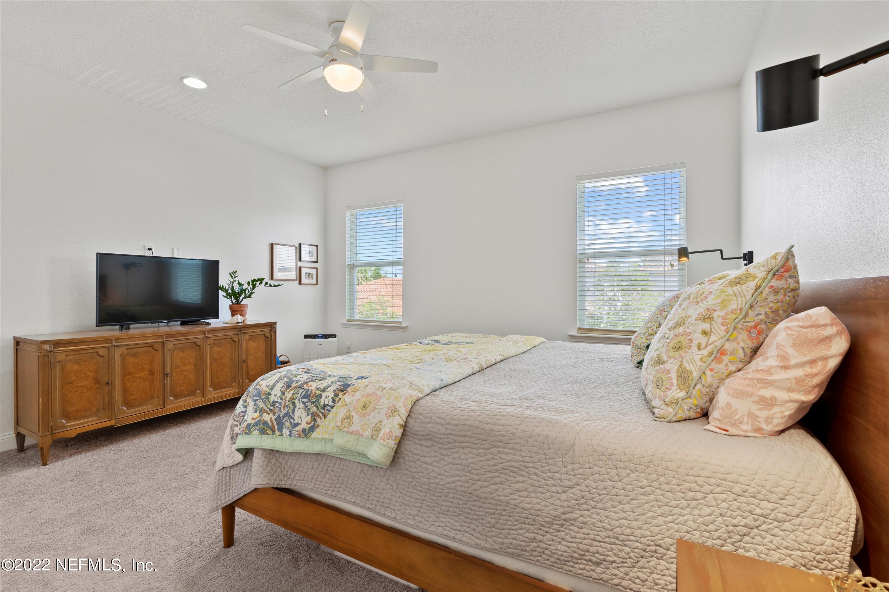 245 Rialto Drive Ponte Vedra, FL 32081 - Photo 17 of 29 a bedroom with a bed and a television