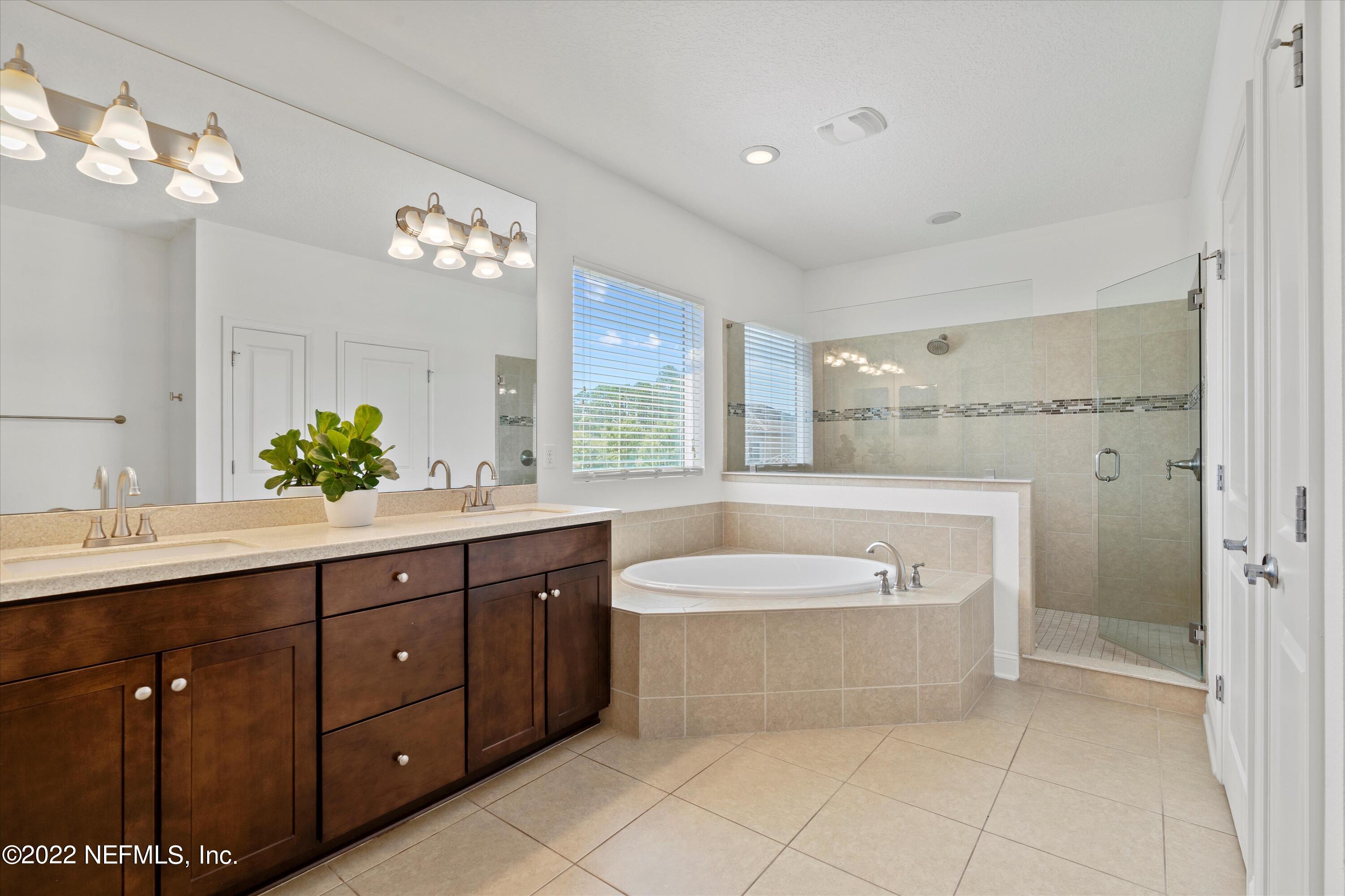 245 Rialto Drive Ponte Vedra, FL 32081 - Photo 20 of 29 a spacious bathroom with a tub a sink shower and mirror