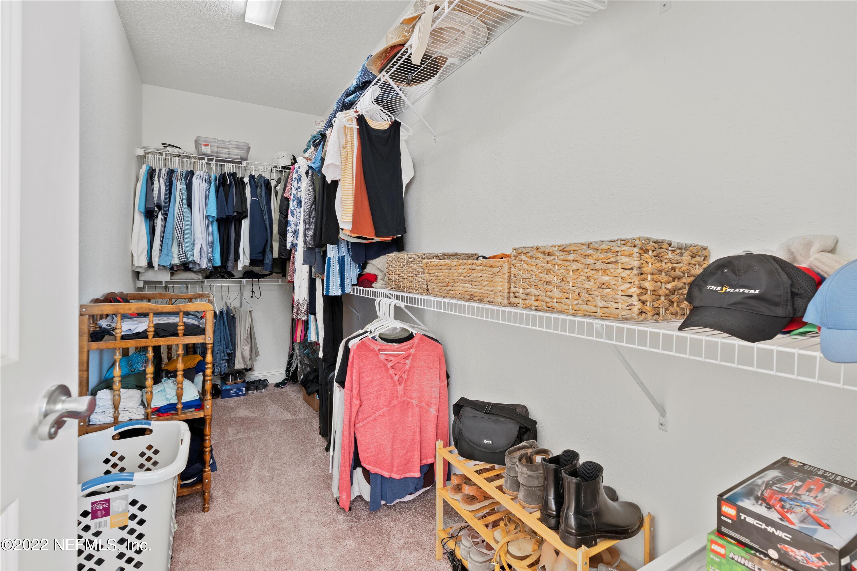 245 Rialto Drive Ponte Vedra, FL 32081 - Photo 22 of 29 a view of walk in closet with clothes and shoes