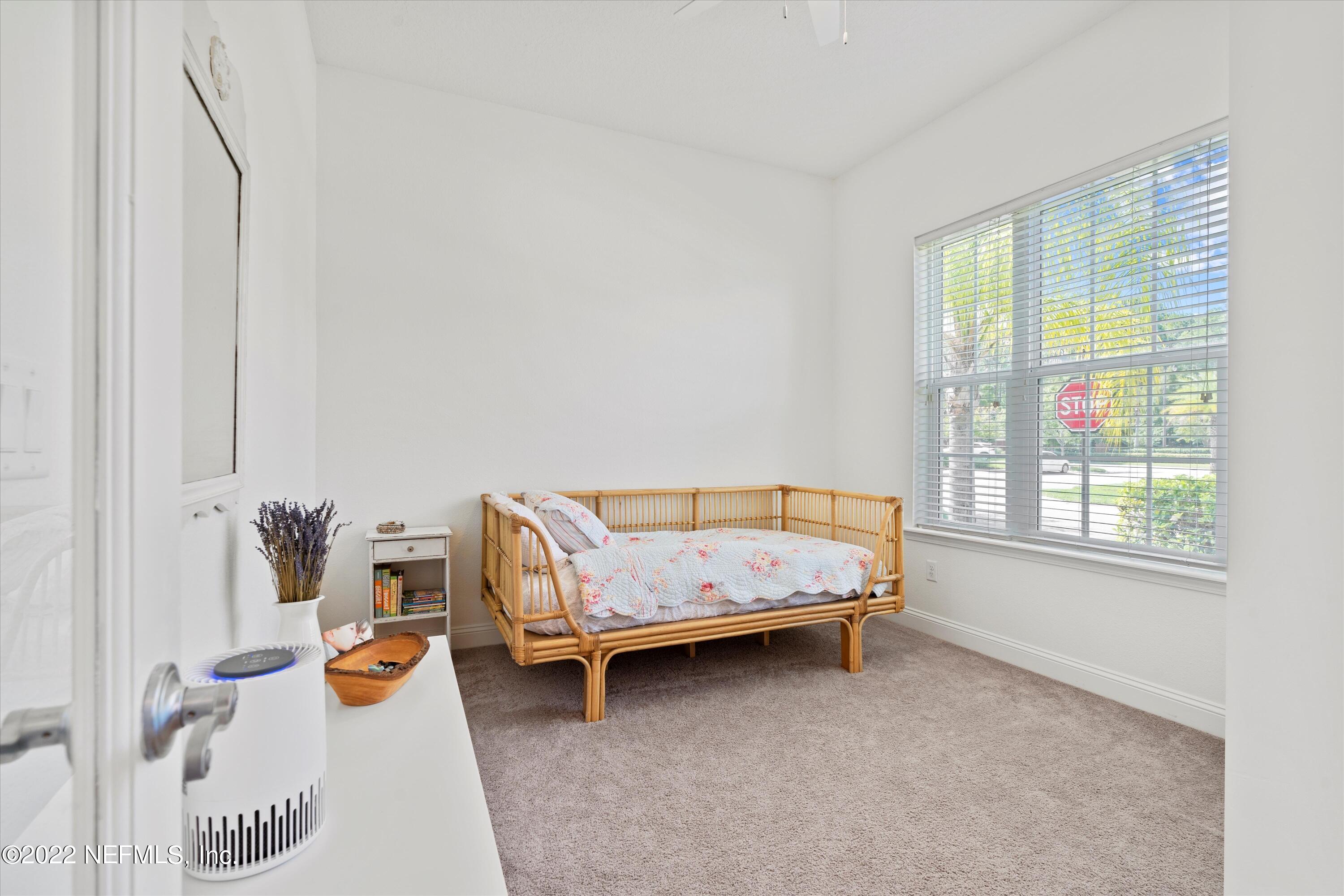 245 Rialto Drive Ponte Vedra, FL 32081 - Photo 23 of 29 a bedroom with furniture and a window