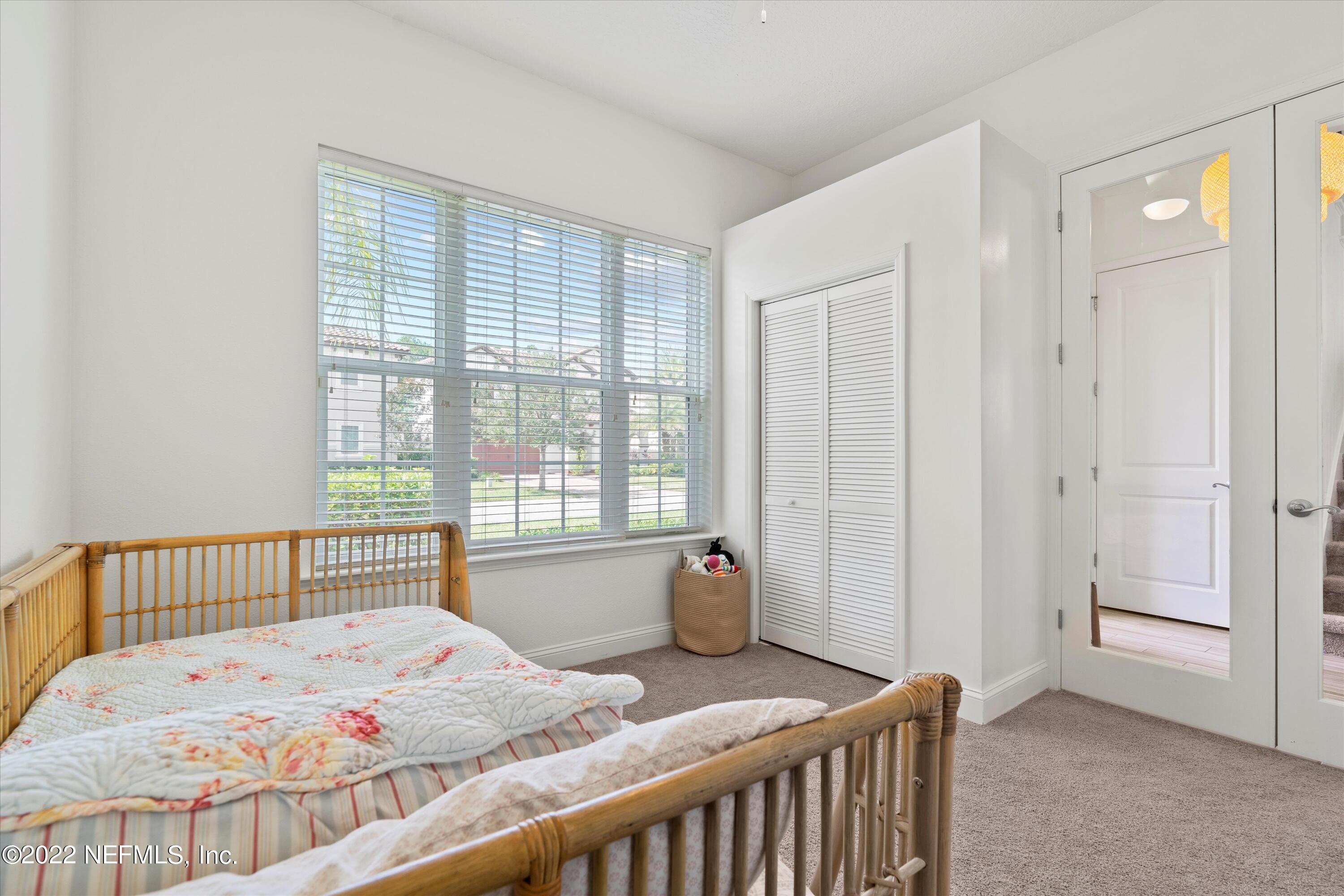 245 Rialto Drive Ponte Vedra, FL 32081 - Photo 24 of 29 a bedroom with a bed and a window