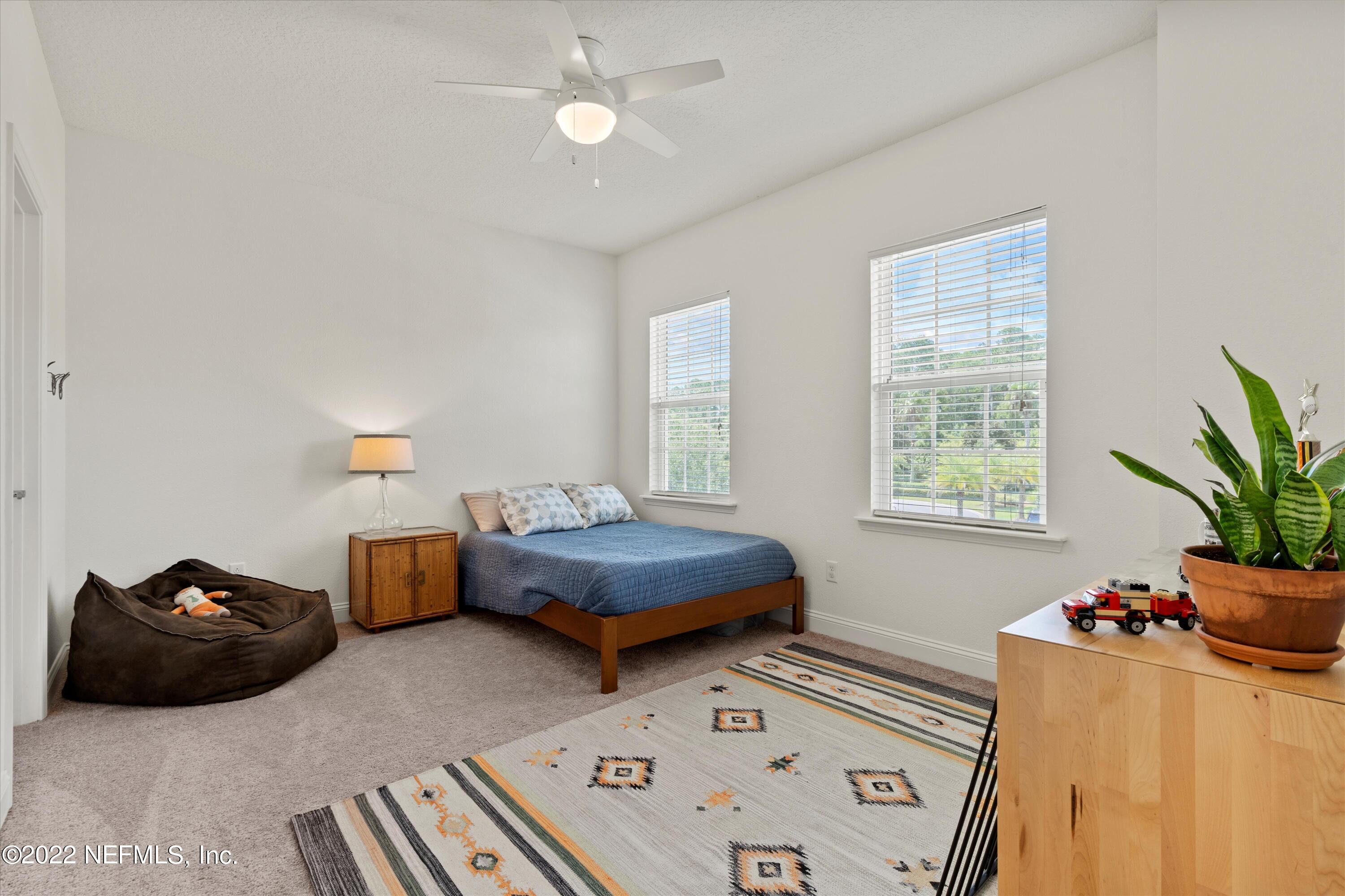 245 Rialto Drive Ponte Vedra, FL 32081 - Photo 25 of 29 a bedroom with furniture and a window