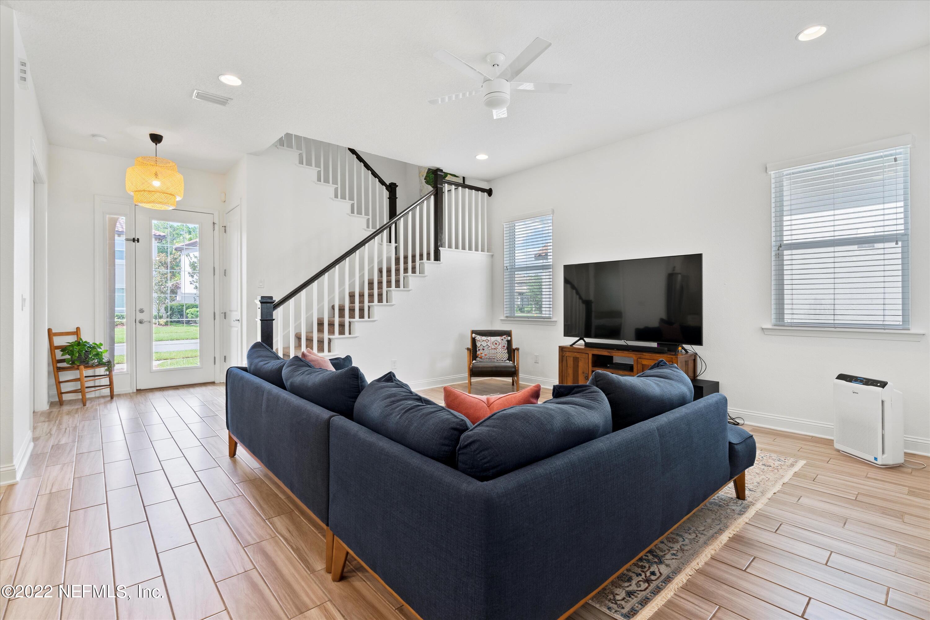 245 Rialto Drive Ponte Vedra, FL 32081 - Photo 6 of 29 a living room with furniture and a flat screen tv