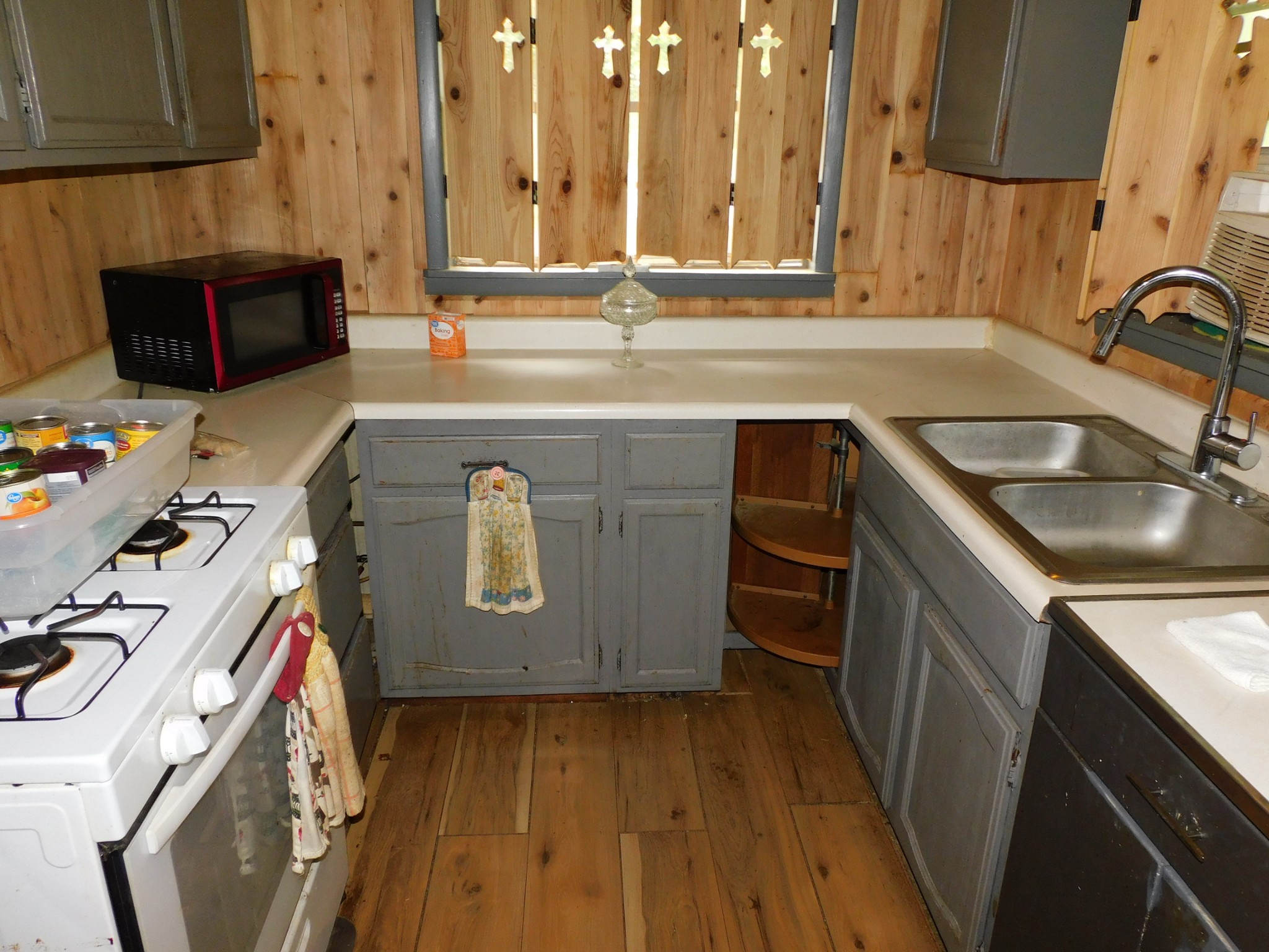 1064 Summitville Road Manchester, TN 37355 - Photo 3 of 15 a kitchen with a sink stove and cabinets
