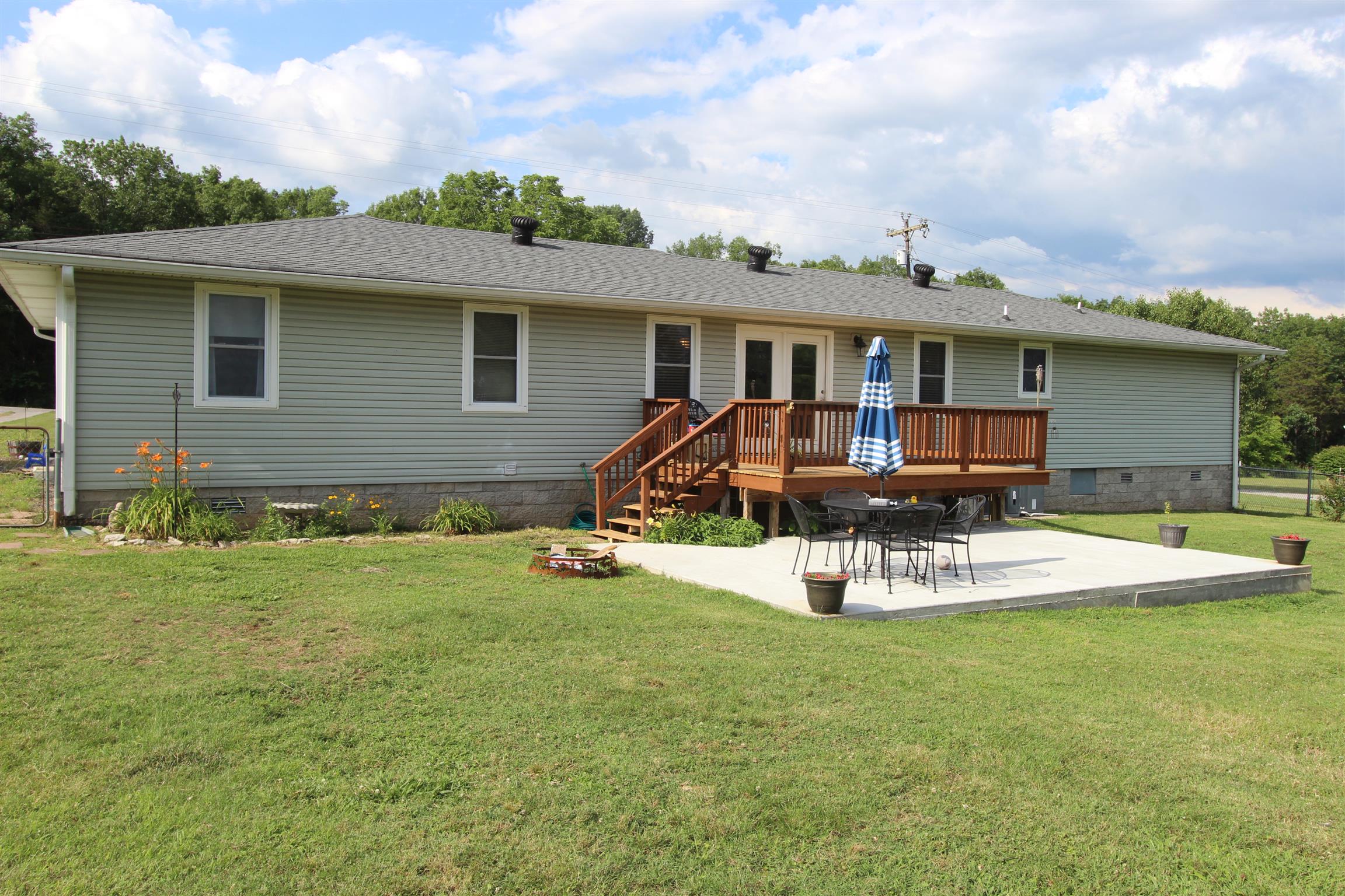 4240 Simmons Bluff Road Lebanon, TN 37090 - Photo 28 of 30 a view of a house with backyard sitting area and garden