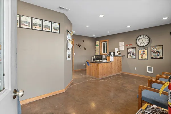 a view of a livingroom with a dinning room and workspace