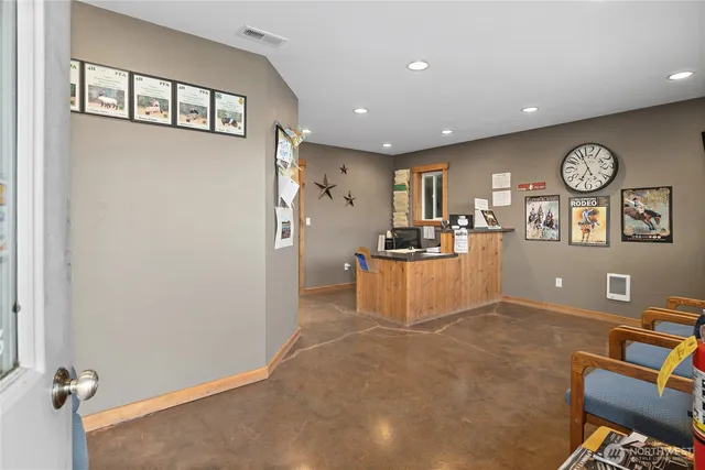 a view of a livingroom with a dinning room and workspace
