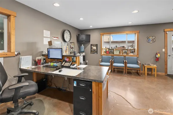 a view of a workspace with furniture