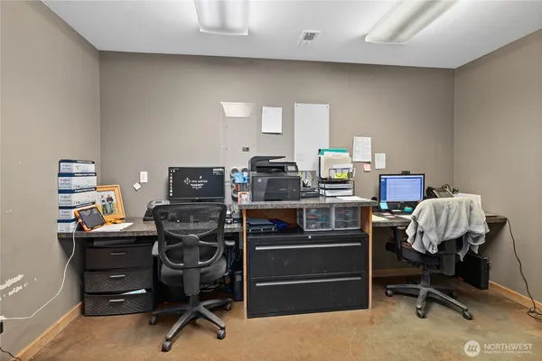 a view of a workspace with furniture