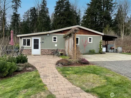 a kitchen with stainless steel appliances granite countertop a refrigerator and a stove