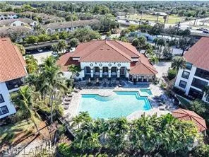 an aerial view of residential houses with yard