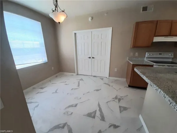 a view of kitchen and sink