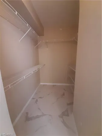 a view of an empty walk in closet