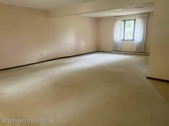 a view of a room that has a window in it