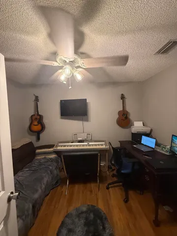 a bathroom with a sink toilet mirror and shower