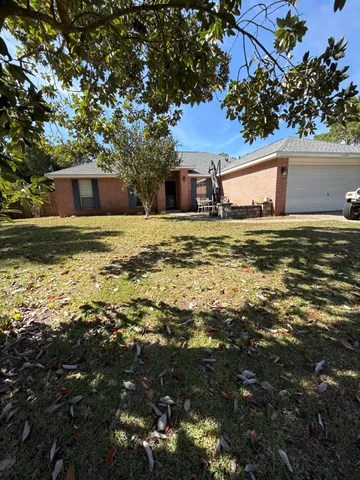 a view of ocean with trees in the background