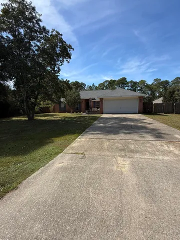 a view of a car in front of house