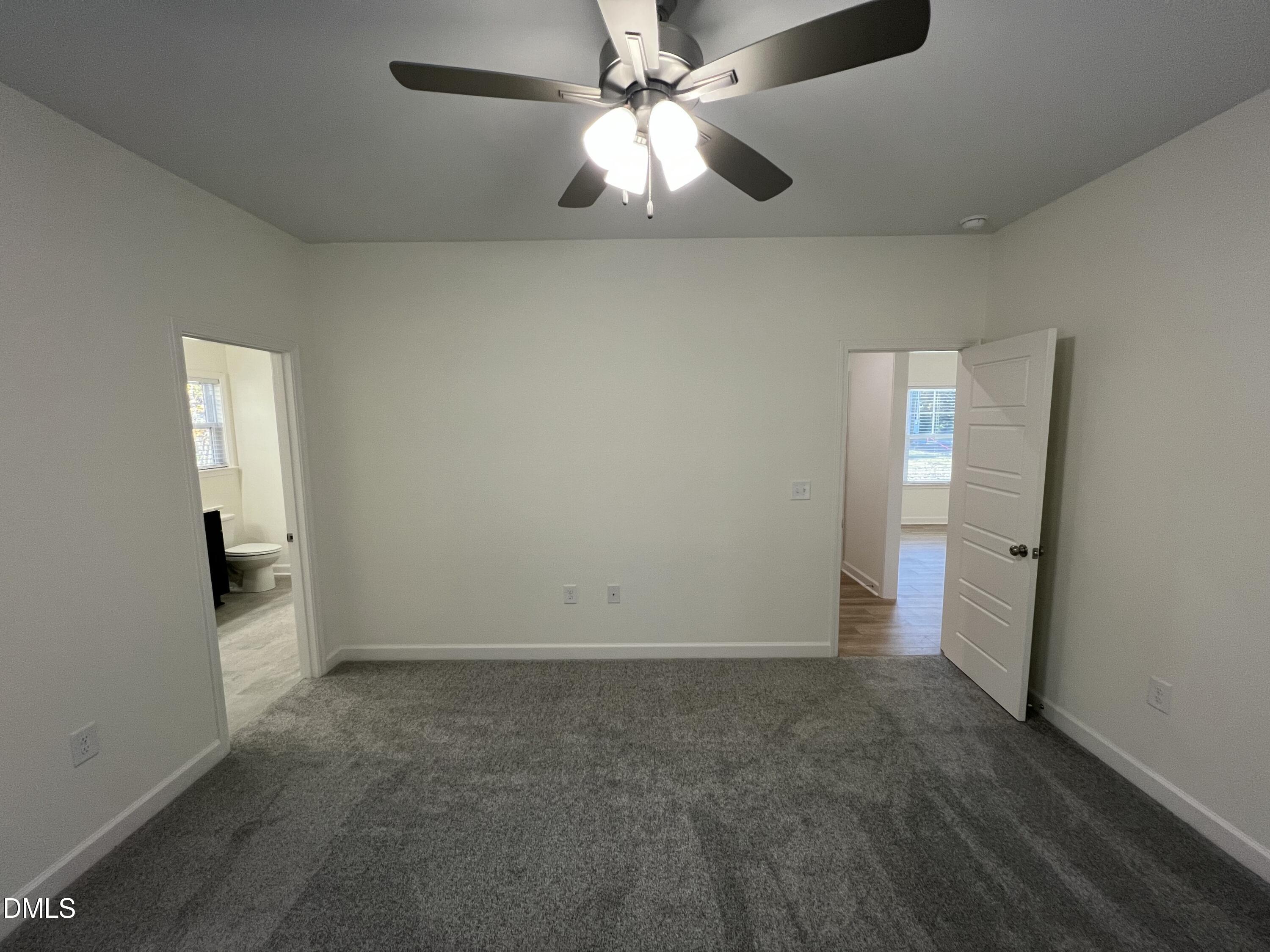 1552 Patterson Road Kinston, NC 28504 - Photo 10 of 23 an empty room with closet and a chandelier fan