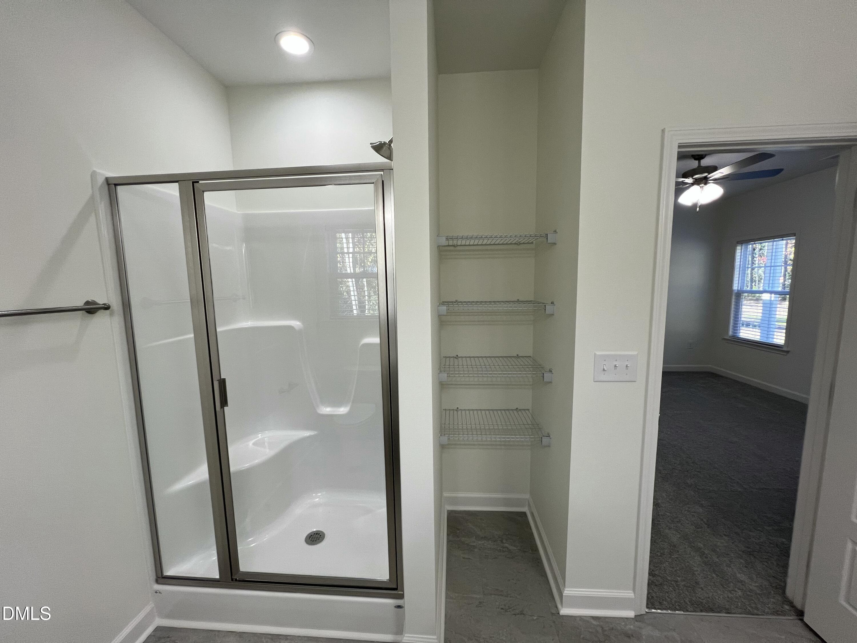 1552 Patterson Road Kinston, NC 28504 - Photo 13 of 23 wooden bathroom with a glass shower door and a mirror