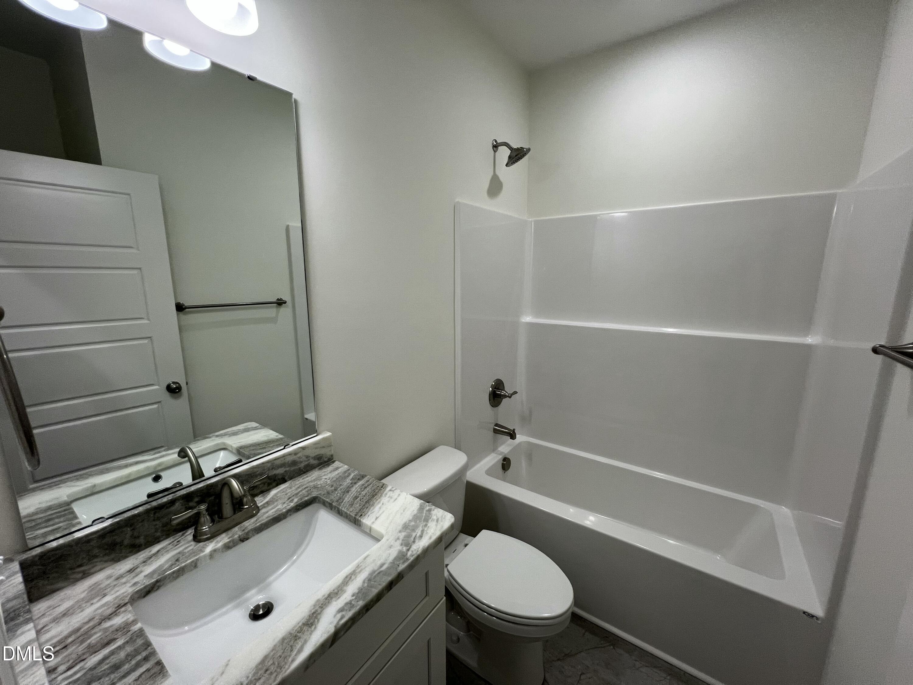 1552 Patterson Road Kinston, NC 28504 - Photo 18 of 23 a bathroom with a sink a toilet and shower