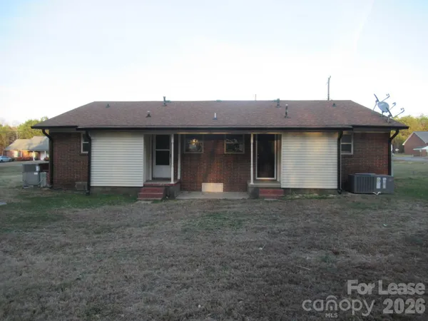 a house view with a backyard space