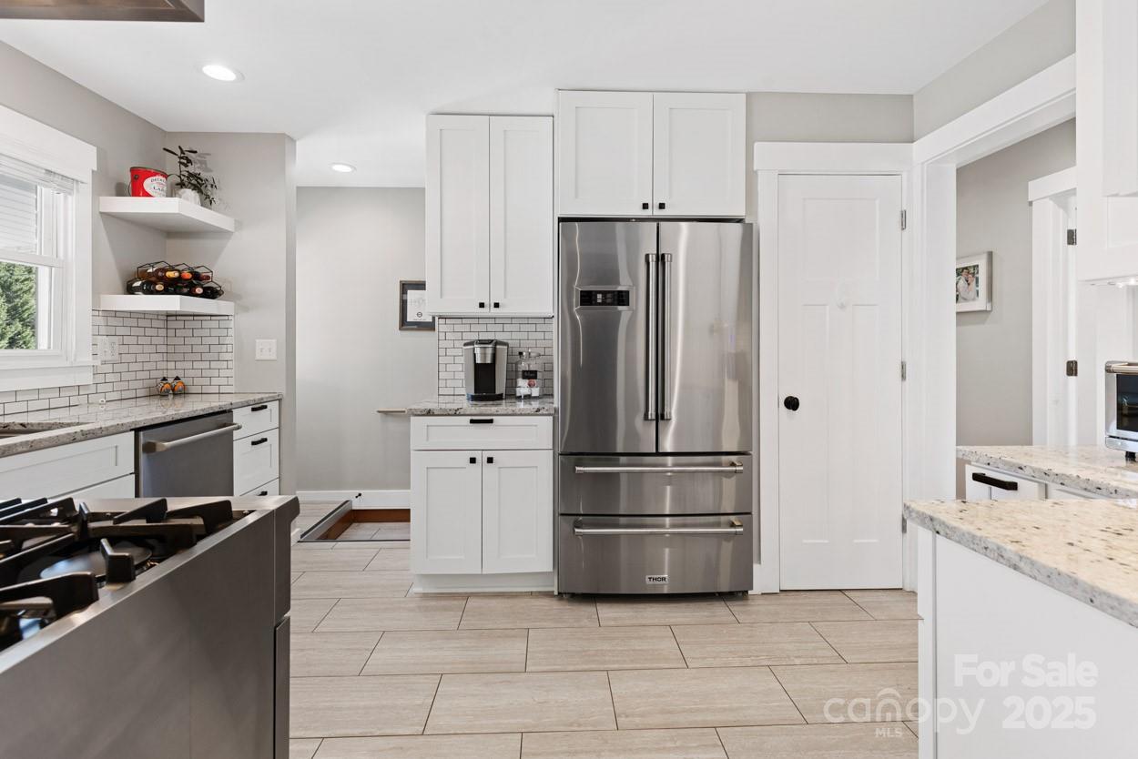 29 Willowbrook Road, Unit 11 Asheville, NC 28805 - Photo 15 of 46 a kitchen with a refrigerator a stove a sink and a refrigerator