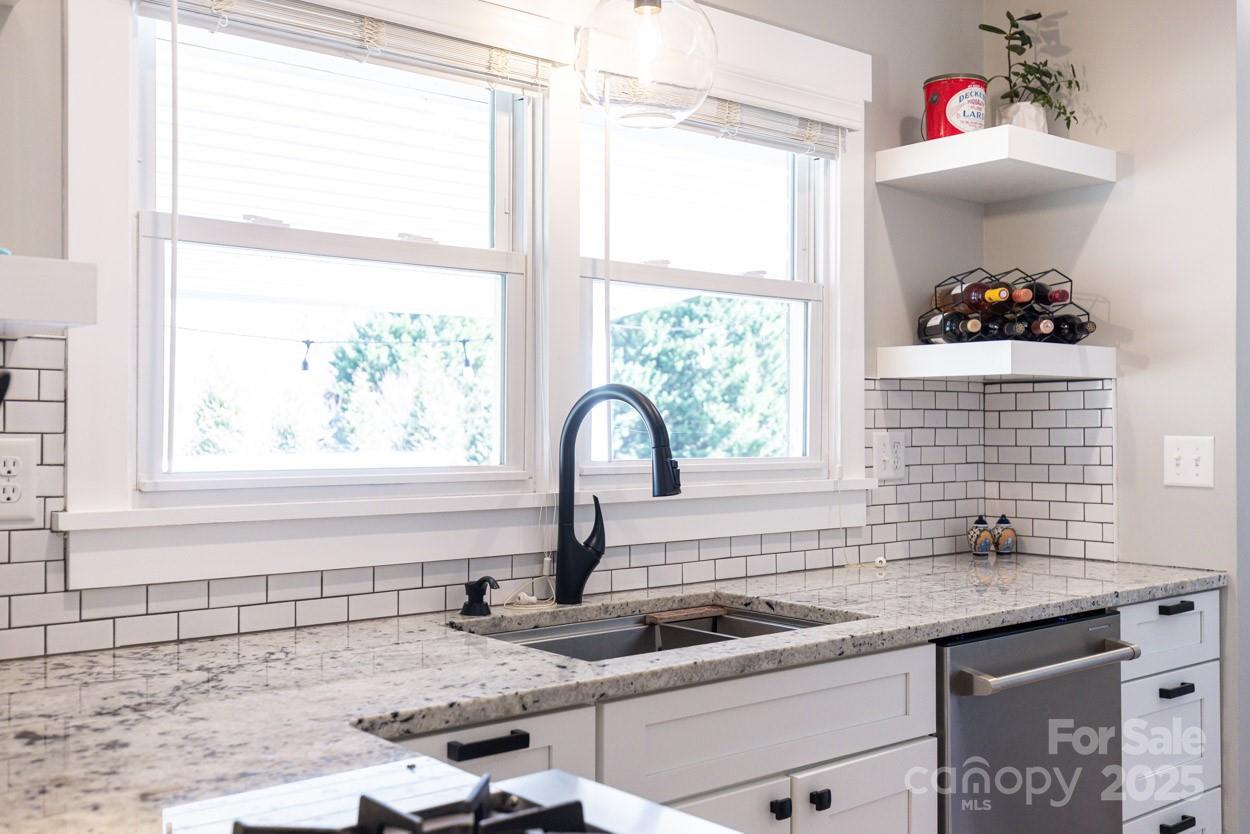 29 Willowbrook Road, Unit 11 Asheville, NC 28805 - Photo 18 of 46 a kitchen with a sink and a window