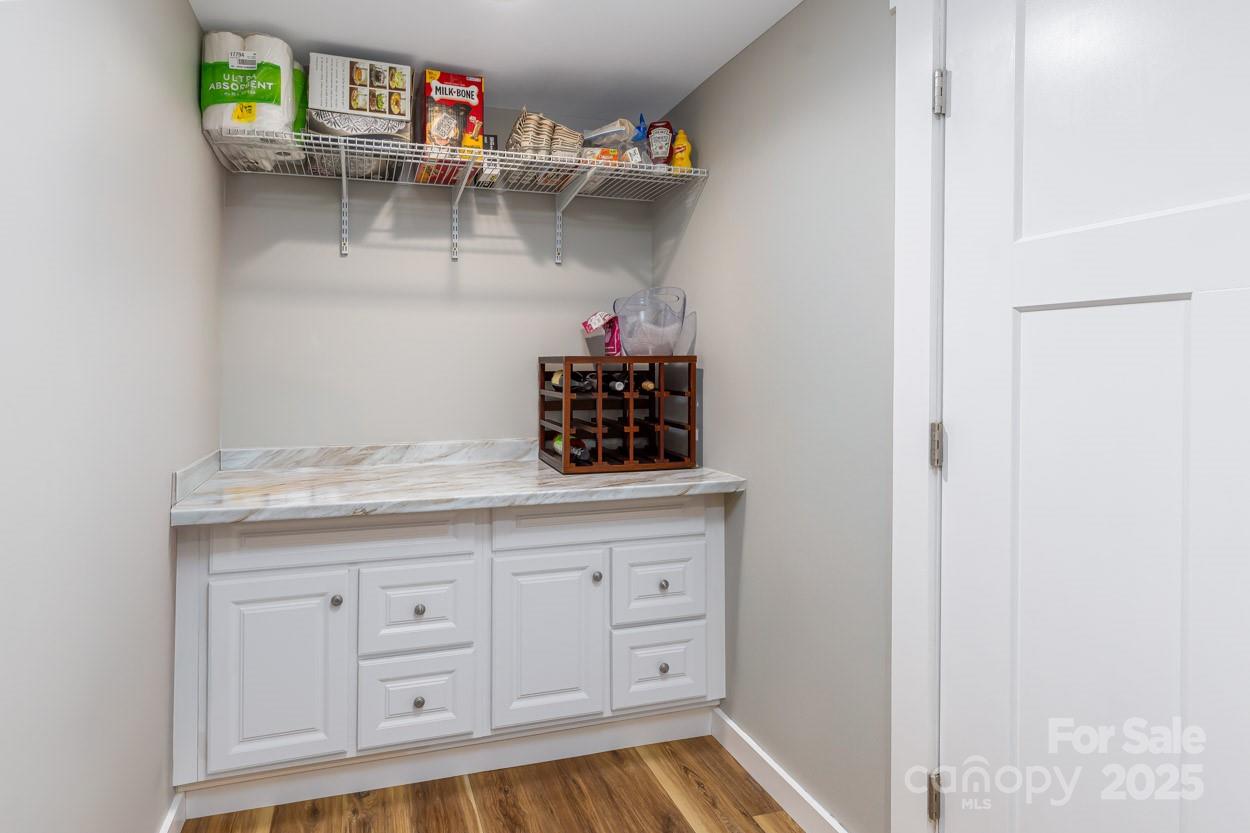 29 Willowbrook Road, Unit 11 Asheville, NC 28805 - Photo 26 of 46 a kitchen with white cabinets and sink